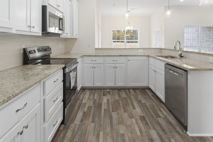 Beautiful new construction 4-bedroom, 2-bath brick home in the - photo 7