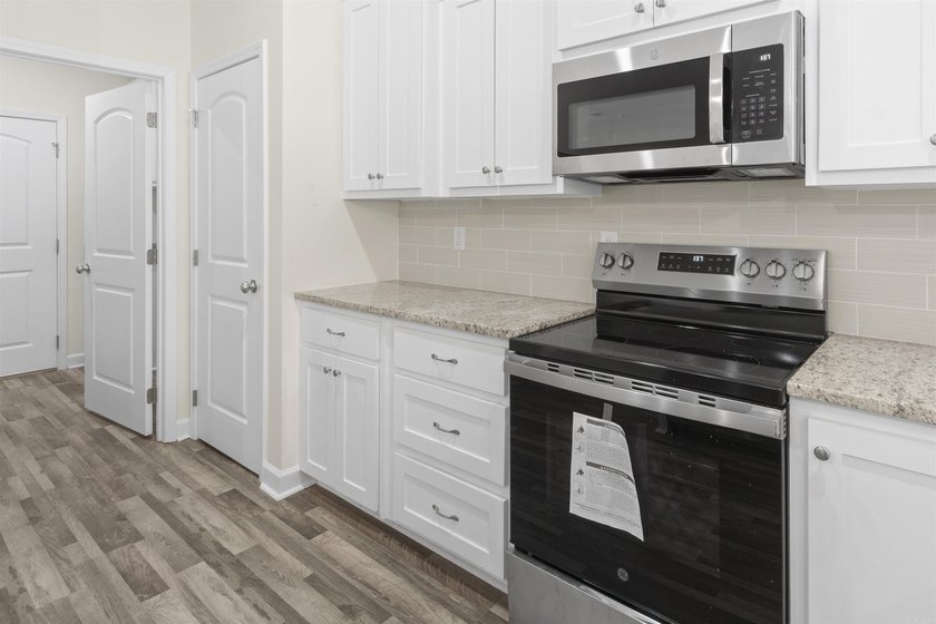 Beautiful new construction 4-bedroom, 2-bath brick home in the - photo 9