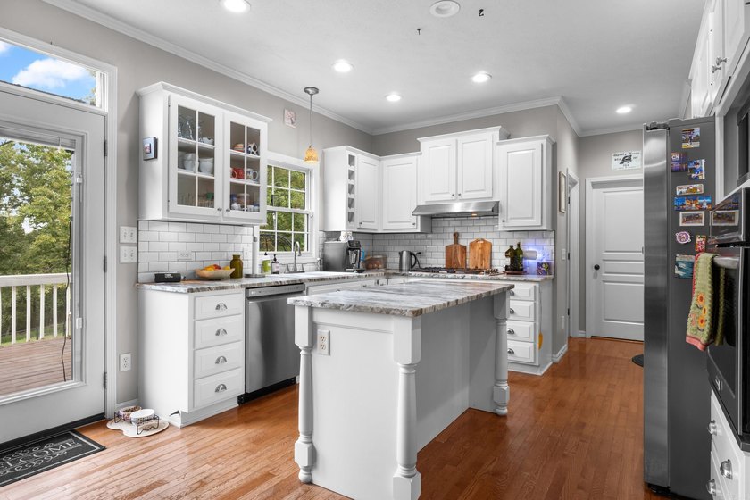 Experience refined lake living in this estate-style custom home - photo 13