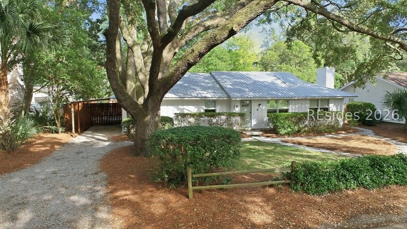 Nestled just steps from the ocean, this charming beach cottage - photo 2