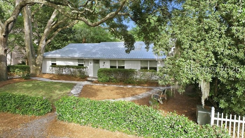 Nestled just steps from the ocean, this charming beach cottage - photo 3