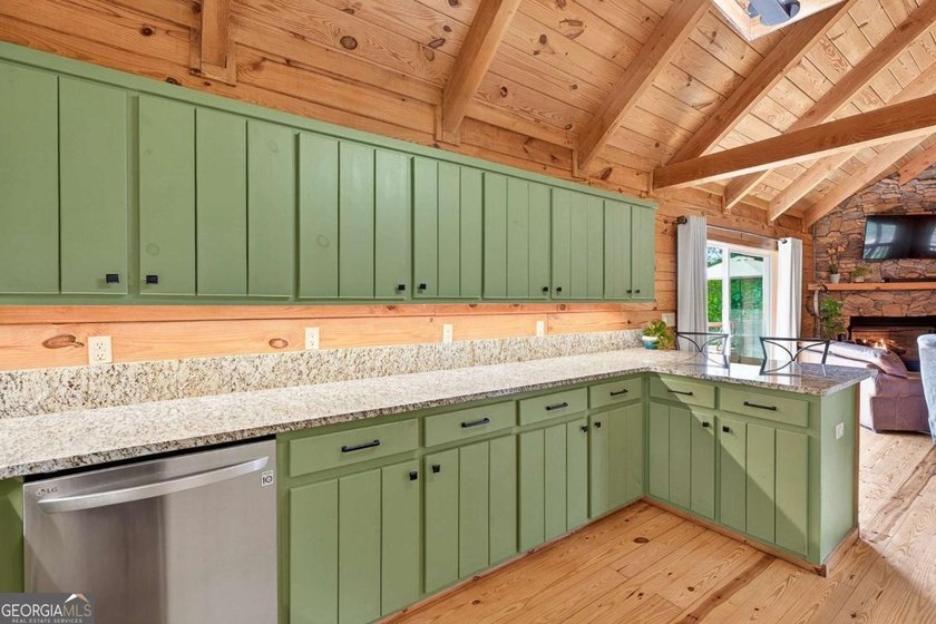 Fully furnished true log home on 5.78 private wooded acres in - photo 12