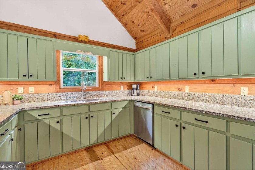 Fully furnished true log home on 5.78 private wooded acres in - photo 16