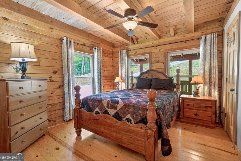 Fully furnished true log home on 5.78 private wooded acres in - photo 24