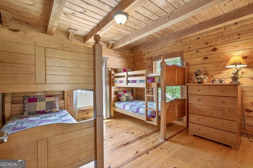 Fully furnished true log home on 5.78 private wooded acres in - photo 25