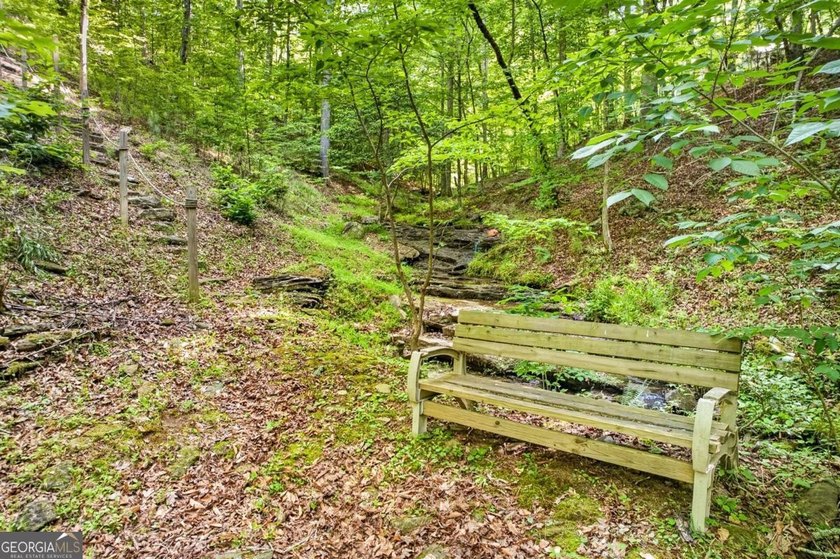 Fully furnished true log home on 5.78 private wooded acres in - photo 47