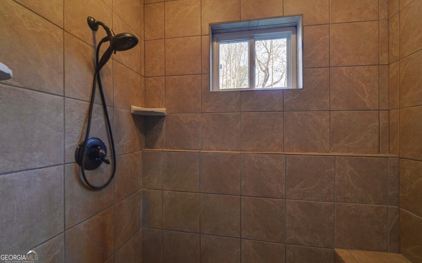 Step into this 3-bedroom, 3.5-bath mountain retreat in scenic - photo 48