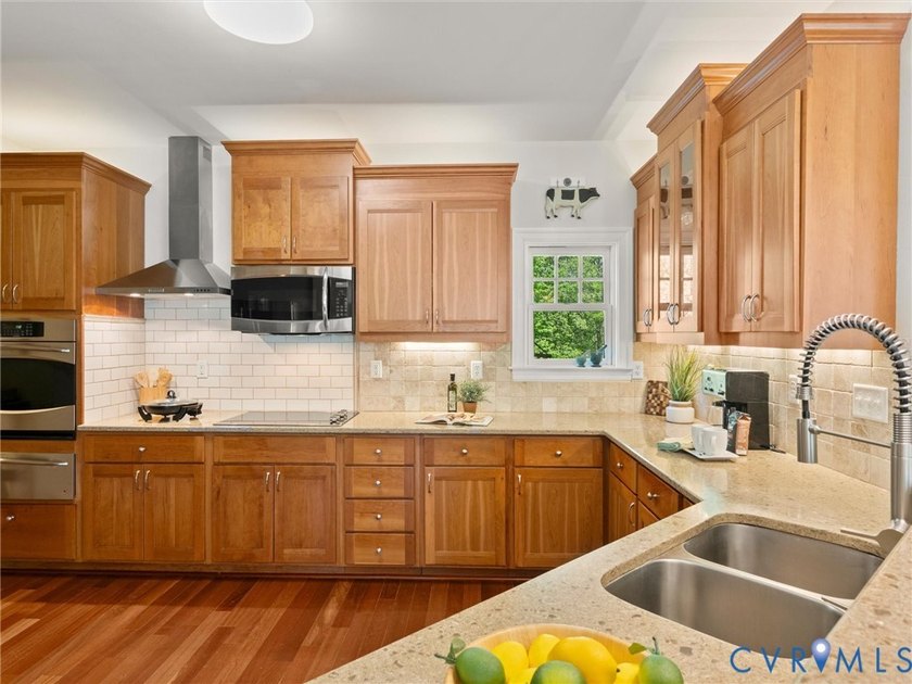 Custom-built and situated on 3.42 private wooded acres, this - photo 6
