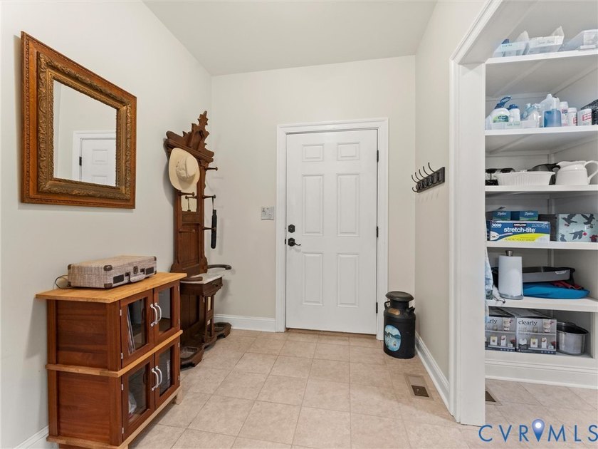 Custom-built and situated on 3.42 private wooded acres, this - photo 9
