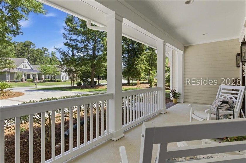 Hampton Lake is a gated community in Bluffton, centered around a - photo 2