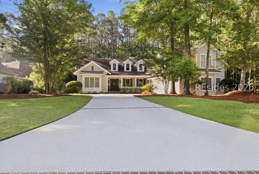 Hampton Lake is a gated community in Bluffton, centered around a - photo 4