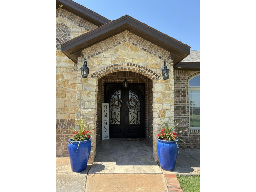 Experience luxury acreage living in Highland Oaks! Situated on a - photo 2