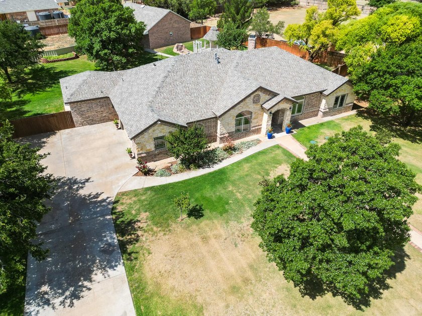 Experience luxury acreage living in Highland Oaks! Situated on a - photo 4