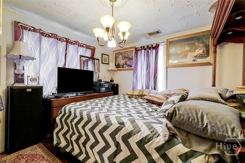 This 1950s ranch bungalow offers four bedrooms and two full - photo 22