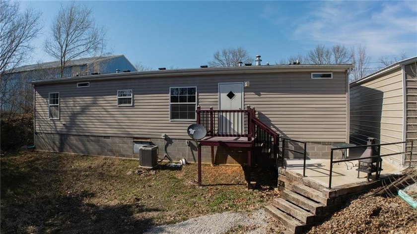 This charming 1,350 sq ft manufactured home sits on a permanent - photo 2
