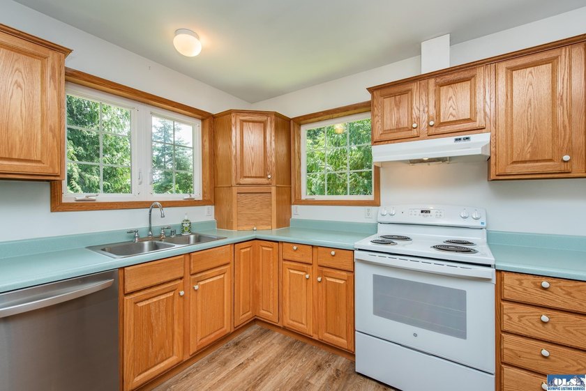 Amongst the trees on an acre this lovely 4 bed 2.5 bath home is - photo 26