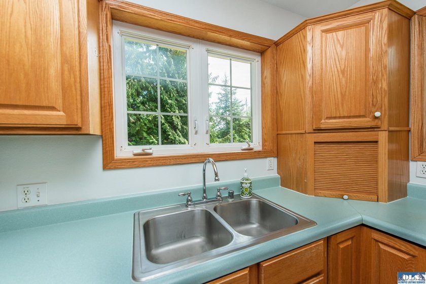Amongst the trees on an acre this lovely 4 bed 2.5 bath home is - photo 27