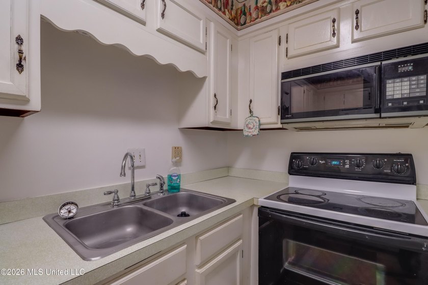 Located within the gated Colony Park Condominium community, this - photo 13