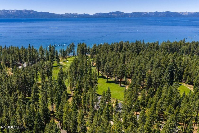 Nestled within the gated, lakefront Glenbrook community on the - photo 2