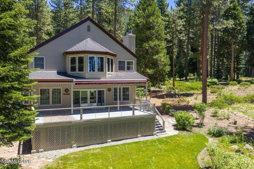 Nestled within the gated, lakefront Glenbrook community on the - photo 5