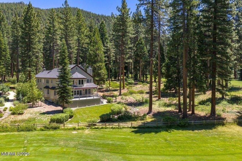 Nestled within the gated, lakefront Glenbrook community on the - photo 6