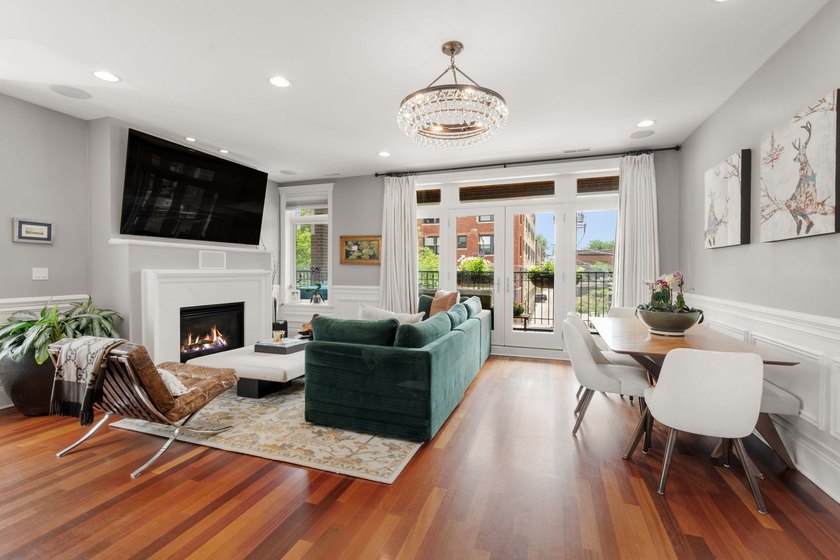 This bright and expansive duplex condominium lives like a - photo 4