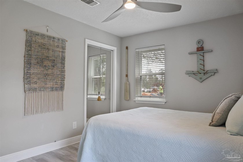 Set along 99 feet of watererfront, this updated brick home - photo 22