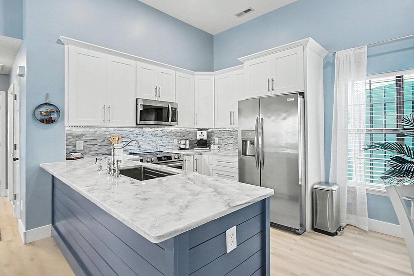 Experience coastal living in a beautifully updated home located - photo 9
