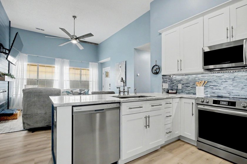 Experience coastal living in a beautifully updated home located - photo 10