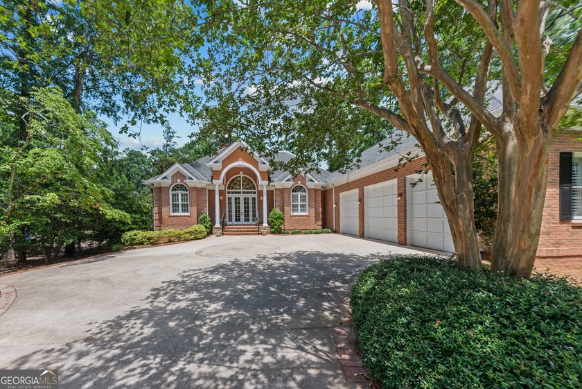 Nestled on 1.50 beautifully landscaped acres in the sought-after - photo 11