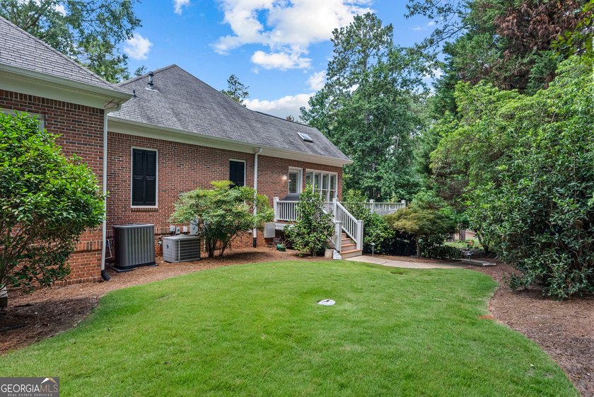 Nestled on 1.50 beautifully landscaped acres in the sought-after - photo 50