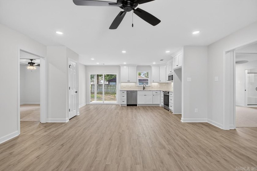 WOW! New Construction! Very pretty white siding w/white brick! - photo 4