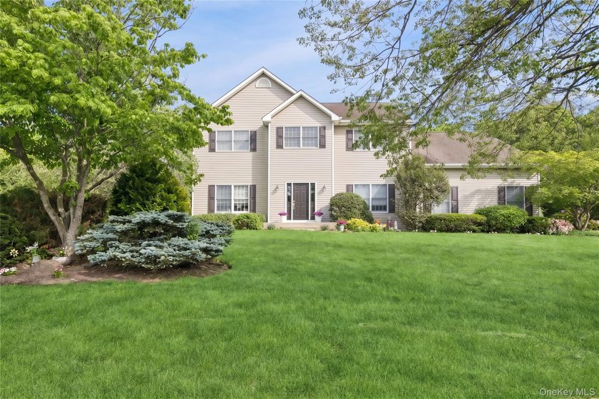 Welcome to 3 Naomi Court, a timeless 5-bedroom, 4.5-bath Center - photo 2