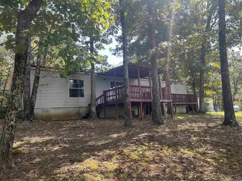 Nestled on 20 beautiful wooded acres, this 3-bedroom, 2-bath - photo 3