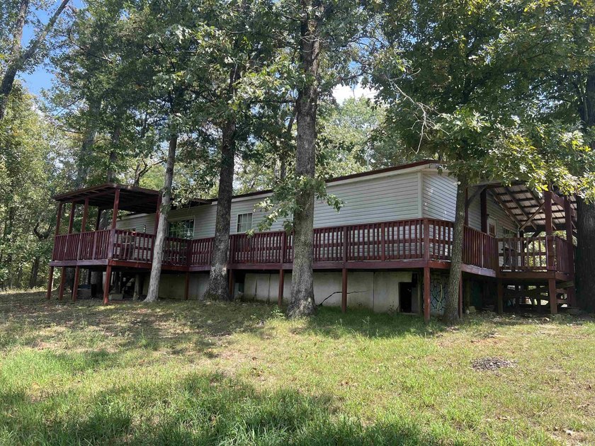 Nestled on 20 beautiful wooded acres, this 3-bedroom, 2-bath - photo 4