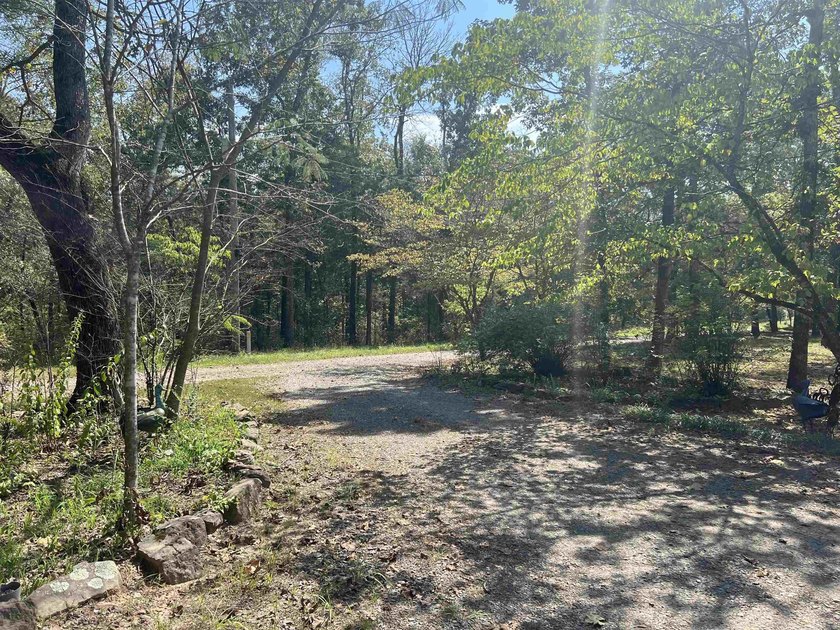 Nestled on 20 beautiful wooded acres, this 3-bedroom, 2-bath - photo 8