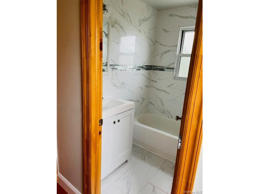 Welcome to this beautifully renovated single-family brick home - photo 5