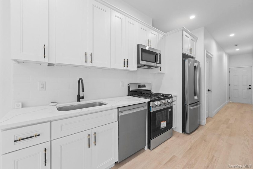 Experience modern living at its finest in this newly renovated - photo 2