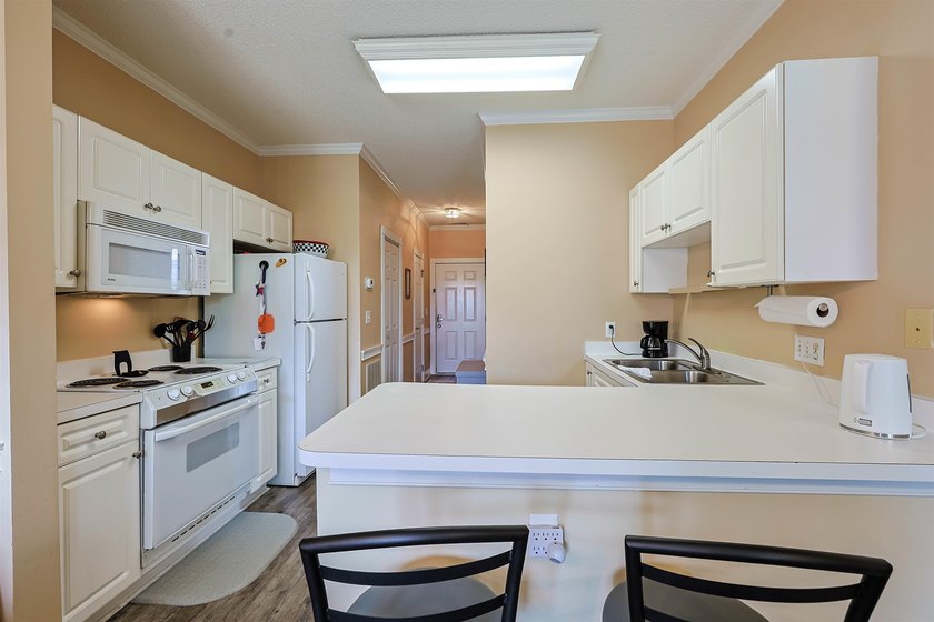 Welcome to 695 Riverwalk Dr, Unit 202, an inviting 1-bedroom, 1 - photo 4