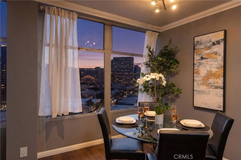 This stylish 1-bedroom, 1-bathroom condo in The Royal Palms is - photo 2