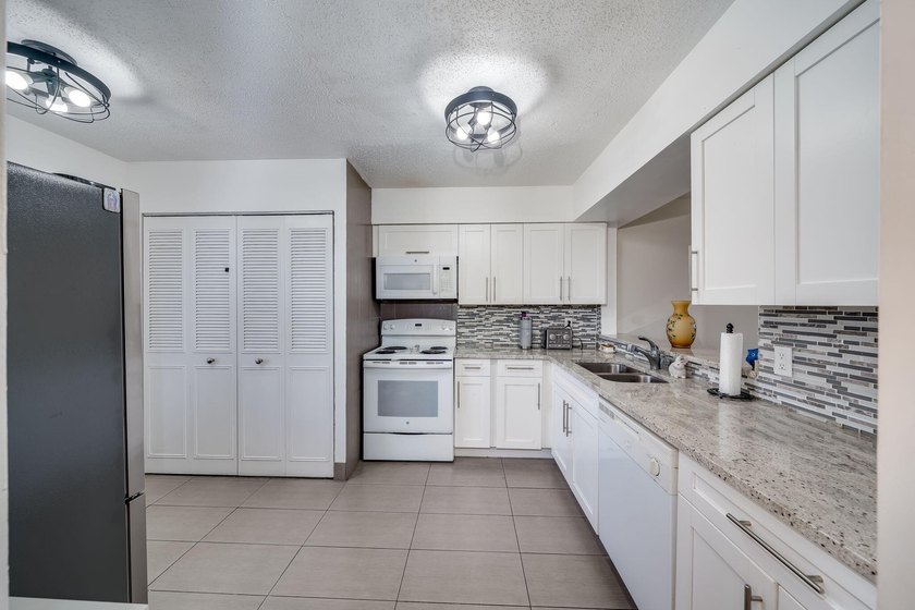 2/2 remodeled 55+ plus community. White Kitchen, New Tile, Wood - photo 6