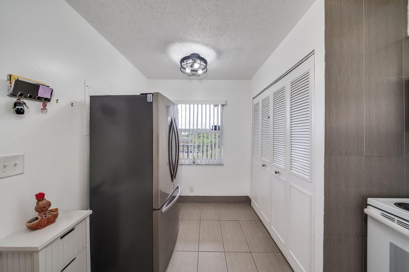 2/2 remodeled 55+ plus community. White Kitchen, New Tile, Wood - photo 8