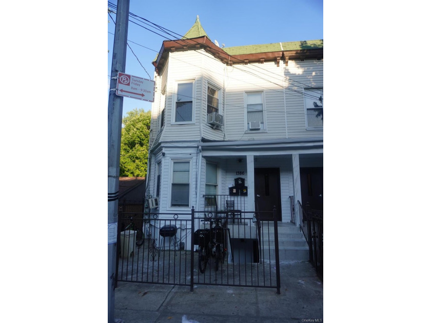 Beautifully newly renovated two-family frame house featuring a - photo 2