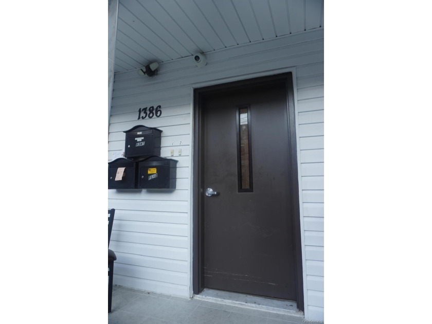 Beautifully newly renovated two-family frame house featuring a - photo 3