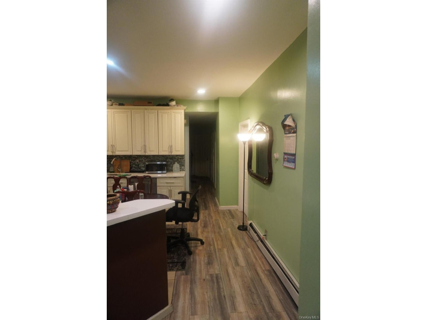 Beautifully newly renovated two-family frame house featuring a - photo 6
