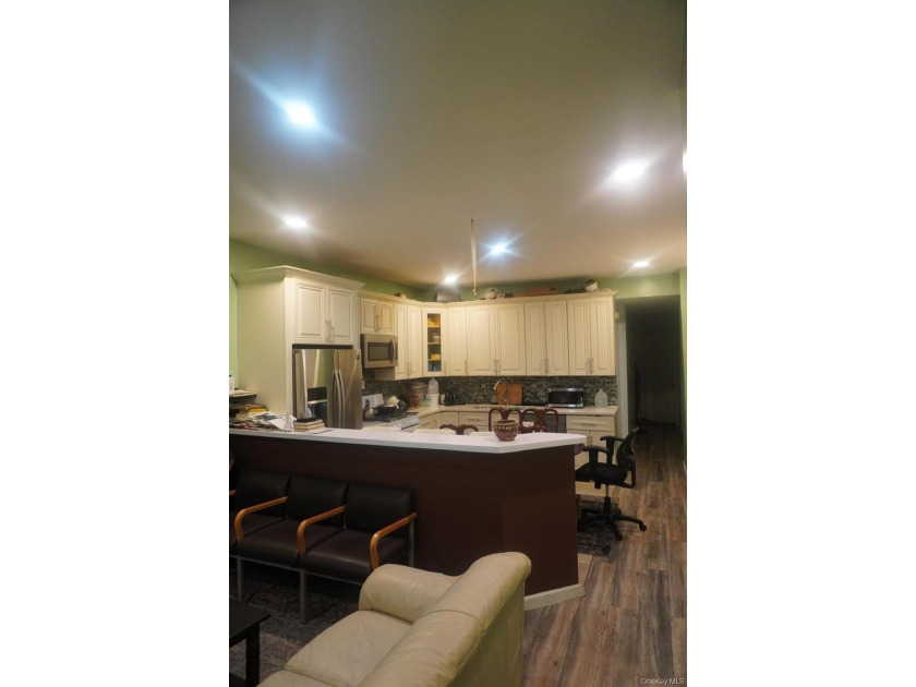 Beautifully newly renovated two-family frame house featuring a - photo 7