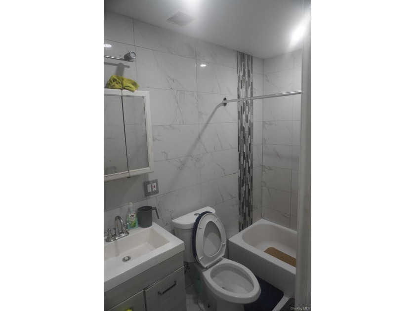 Beautifully newly renovated two-family frame house featuring a - photo 8