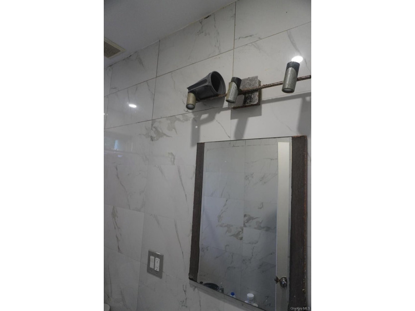 Beautifully newly renovated two-family frame house featuring a - photo 9