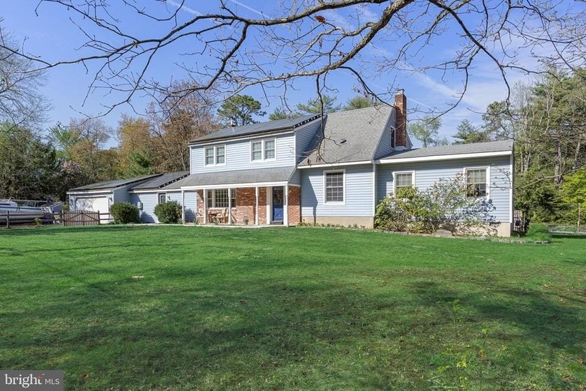 Welcome to this spacious 5-bedroom, 2.5-bath home nestled in the - photo 2