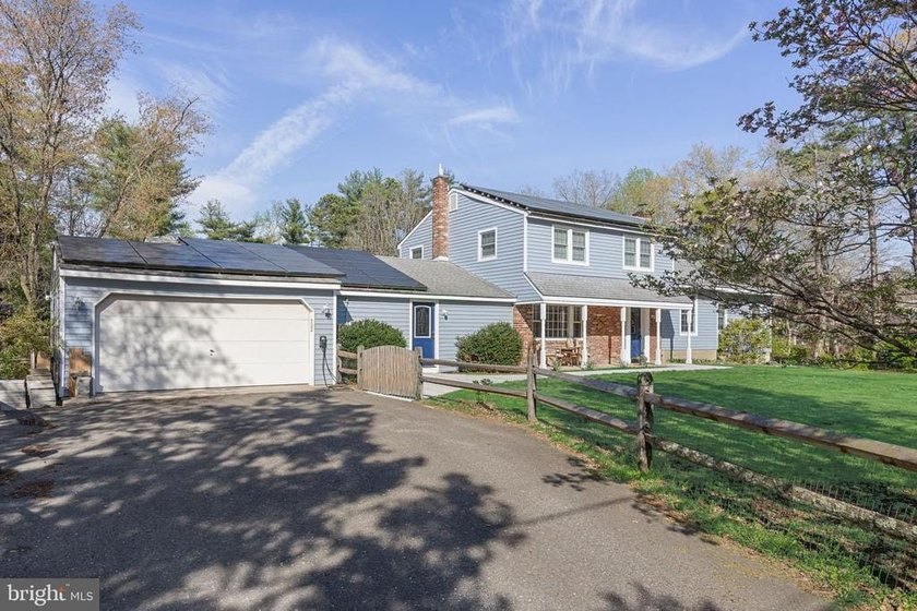 Welcome to this spacious 5-bedroom, 2.5-bath home nestled in the - photo 3